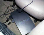 Sony Playstation about to be mounted under rear seating
