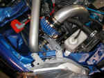 Closeup showing GReddy air filter and piping, MSD SCI ignition system and MSD Blaster SS coil