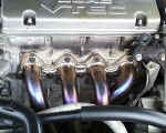 GReddy stainless steel header on H22 engine