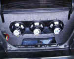 Finished view of tri-isobaric box with 6 10" subs and three amps