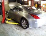 350Z on lift to install wheels and cold air intake system
