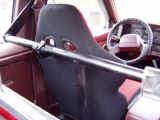 Back side view of custom harness bar installed in truck cabin