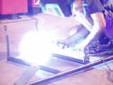 Final welding of harness bar for structural integrity