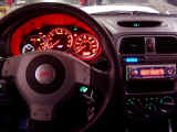 Dash lit up with GReddy turbo timer and JVC CD with red screen