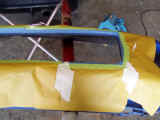 Front bumper trimmed and masked for painting