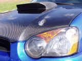 Closeup view of ViS Racing Sports carbon fiber hood and Sparco hood pin set