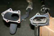 Comparison of former HKS downpipe on left and new Invidia downpipe with bellmouth on right