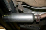 Old exhaust system with muffler added before removal