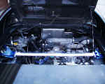 Engine compartment view showing Cusco rear strut brace and Zex nitrous plumbing